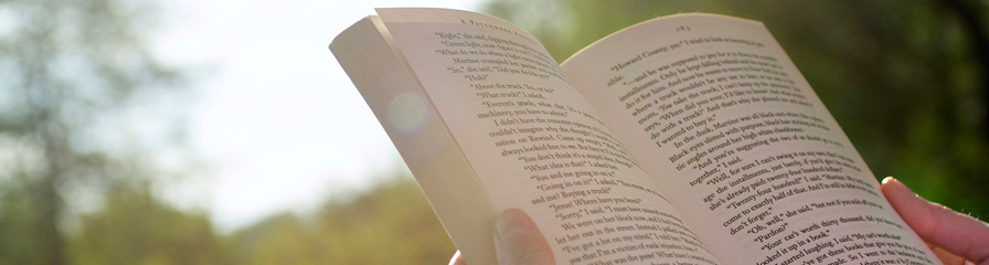 Reading a book outdoors